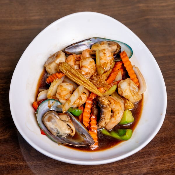 Thai Palace MD's seafood stir-fry with shrimp, mussels, scallops, and vegetables in a savory sauce.