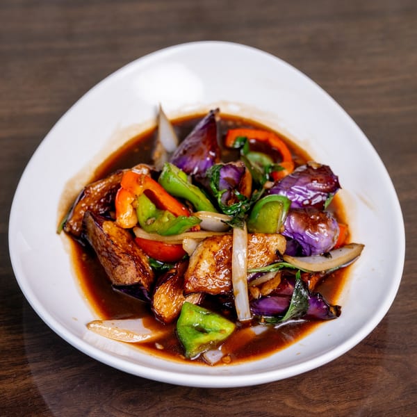 Thai Palace MD's stir-fried eggplant with bell peppers, onions, and basil in a savory sauce.